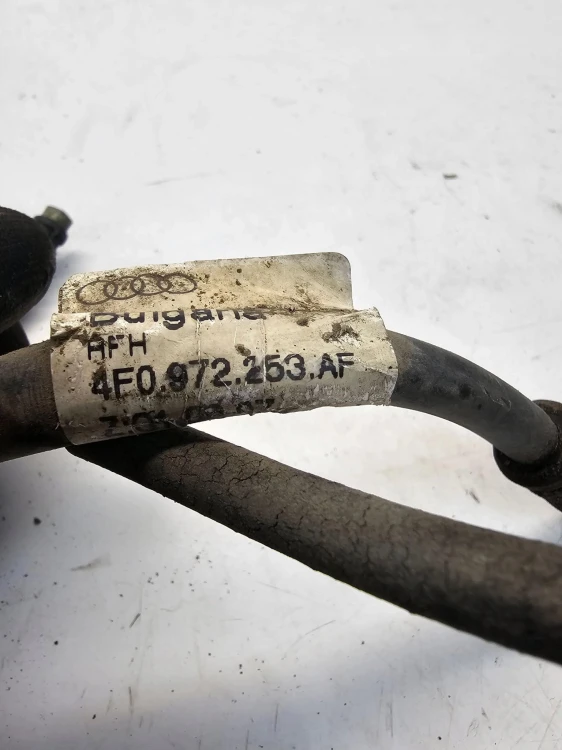 WIĄZKA ZACISKU LEWY TYŁ AUDI A6 C6 4F0972253AF