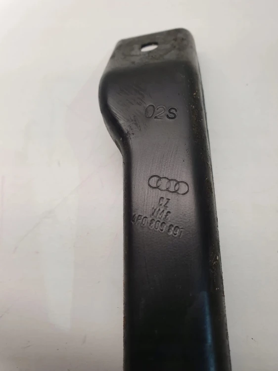 MOCOWANIE WSPORNIK PASA AUDI A6 C6 LEWY 4F0809891