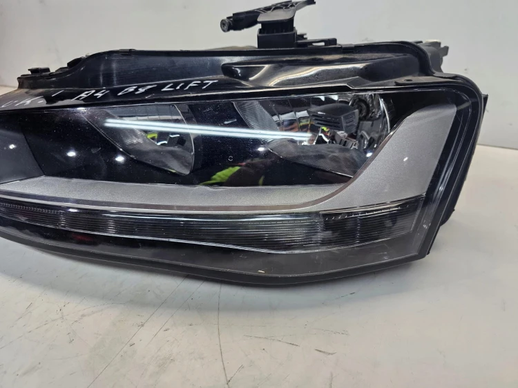 REFLEKTOR LEWY AUDI A4 B8 LIFT UK 8K0941003M